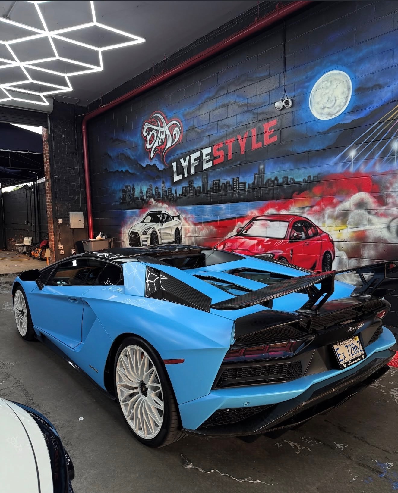 Baby blue Lamborghini Aventador S with carbon accents